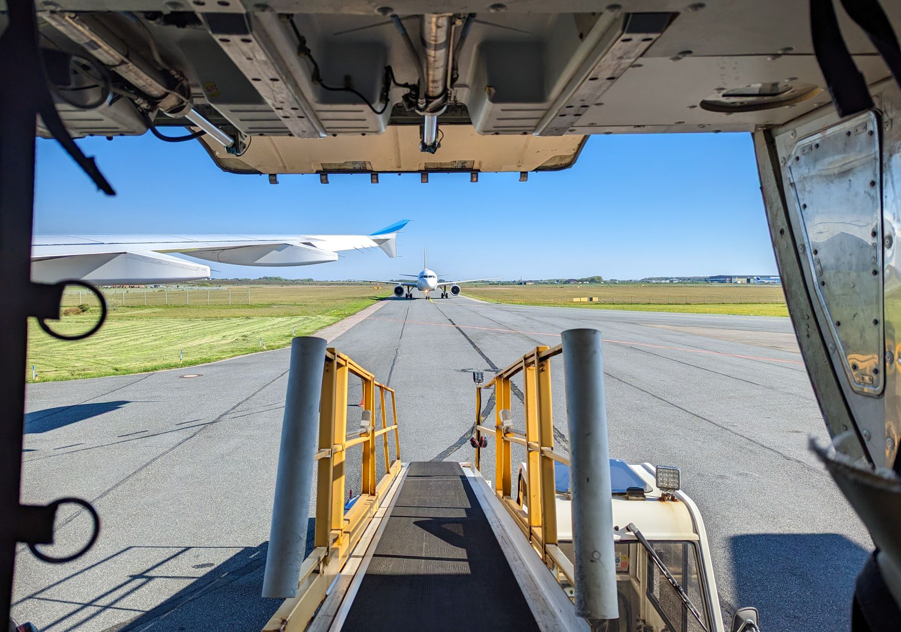 View from aircraft cargo hold onto the high-loader