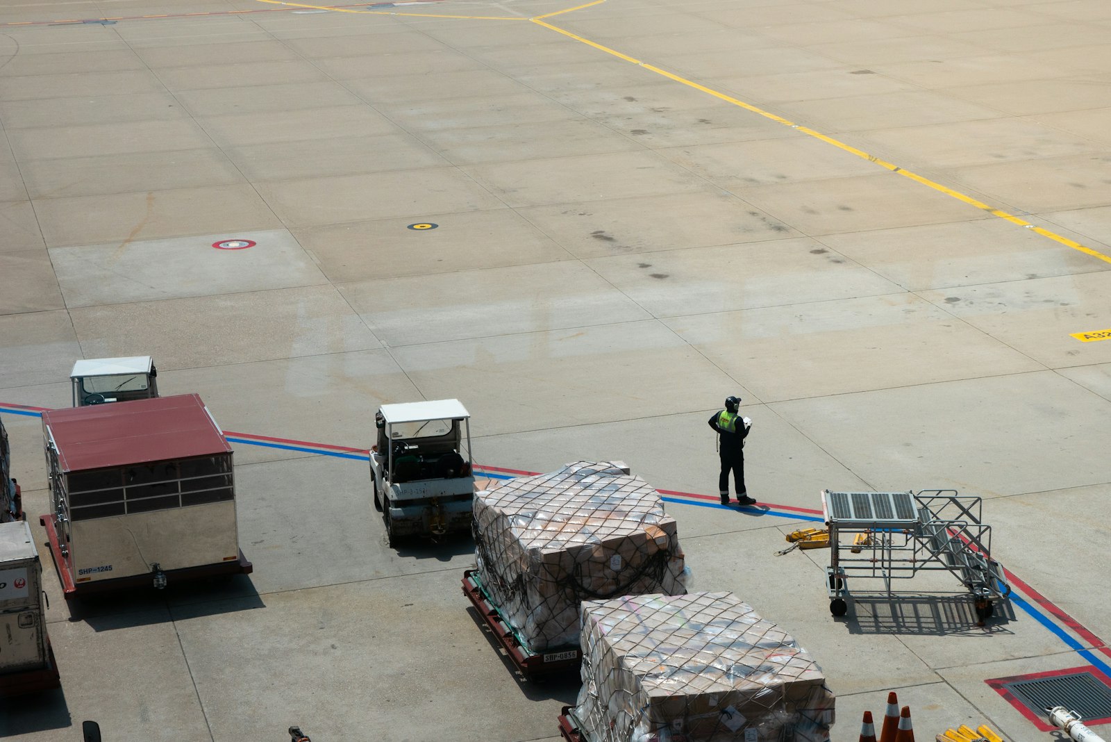 Netted air cargo pallets on the airport apron