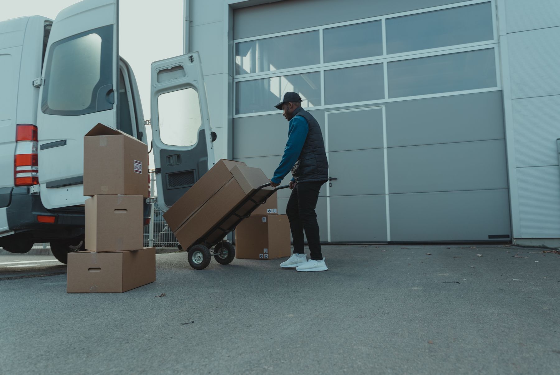 Workers packing and labelling shipments in an export warehouse