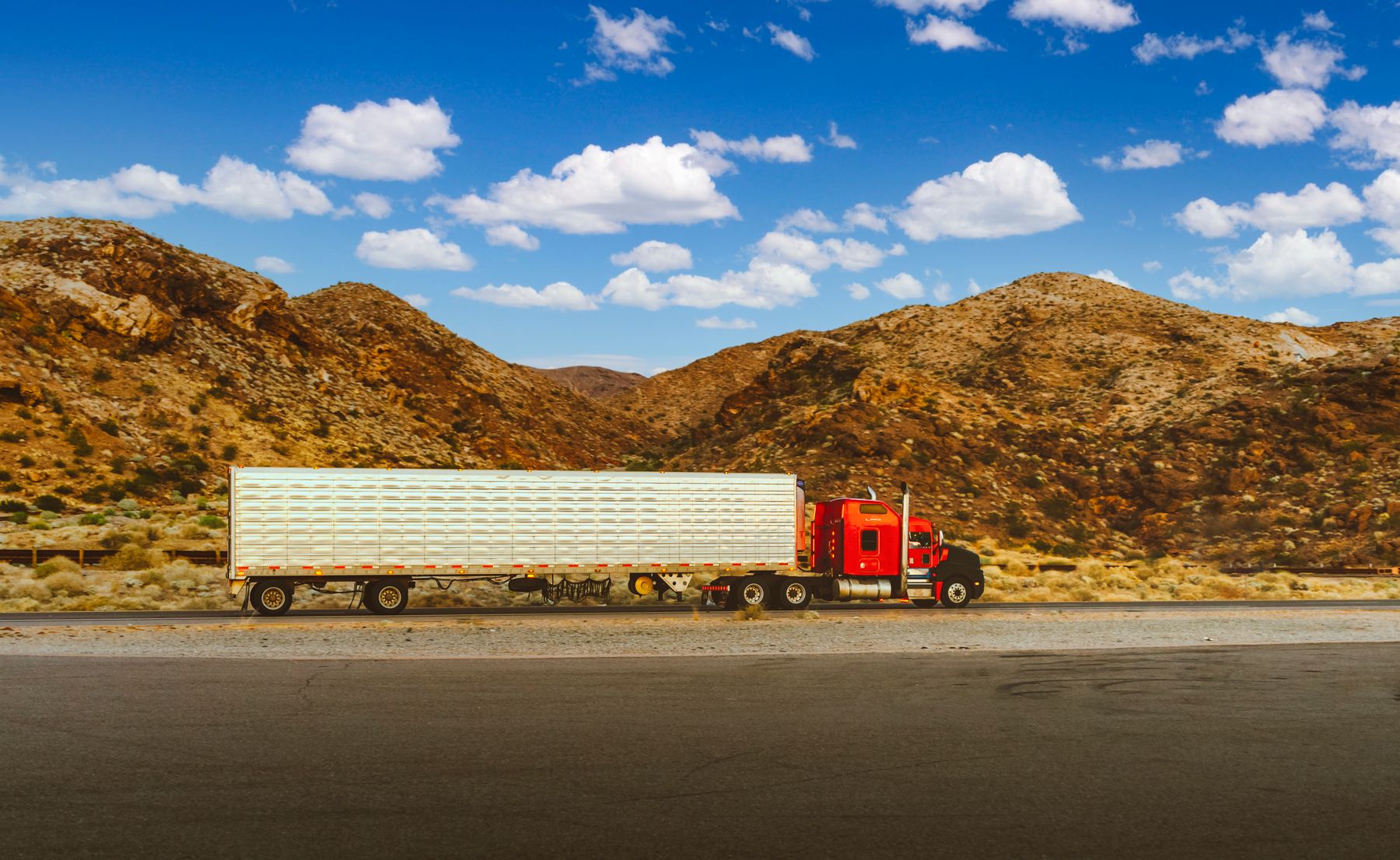 FTL container truck on a long-haul highway