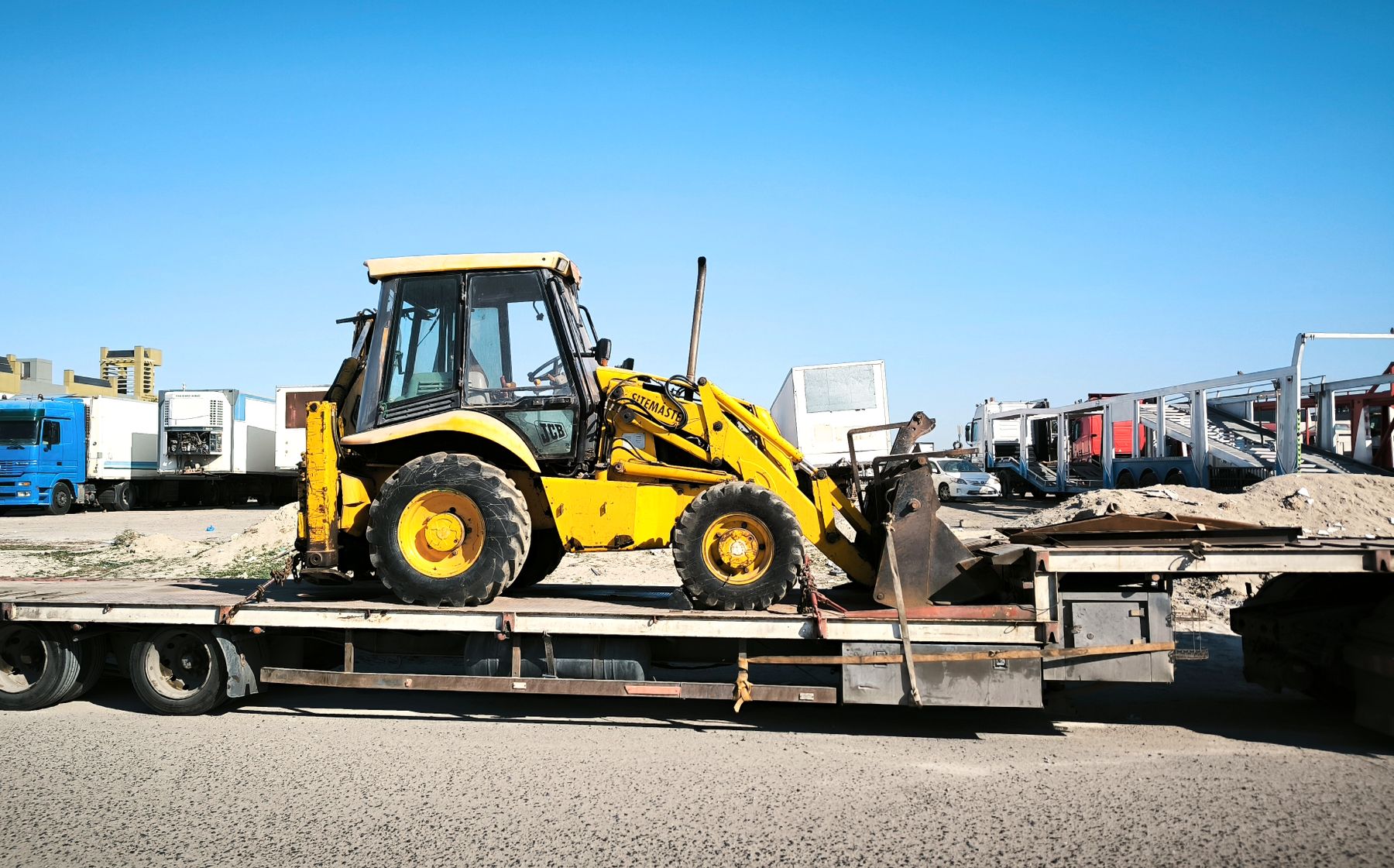 Oversize load secured on a low-bed trailer
